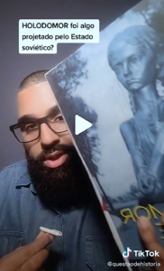 Prof. Higor Figeuira Ferreira holding up Valentina Kuryliw’s book on his TikTok video announcing his upcoming interview with Kuryliw.