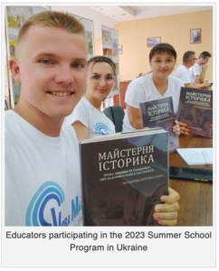 Educators participating in the 2023 Summer School Program in Ukraine for teaching human rights and the Holodomor hold up free copies of Valentina Kuryliw’s most recent publication, The Historian’s Craft Lesson on the Holodomor, used in teacher training.